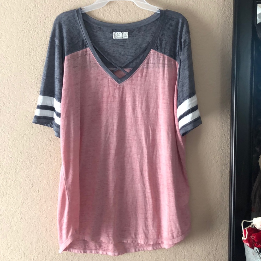 Maurices football top with cris cross neckline!